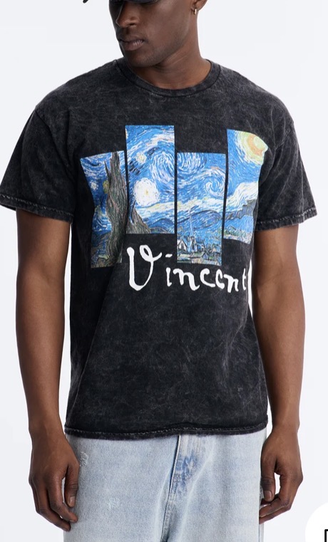 Model wearing a washed black tee with Van Gogh's Starry Night panels and a Vincent signature