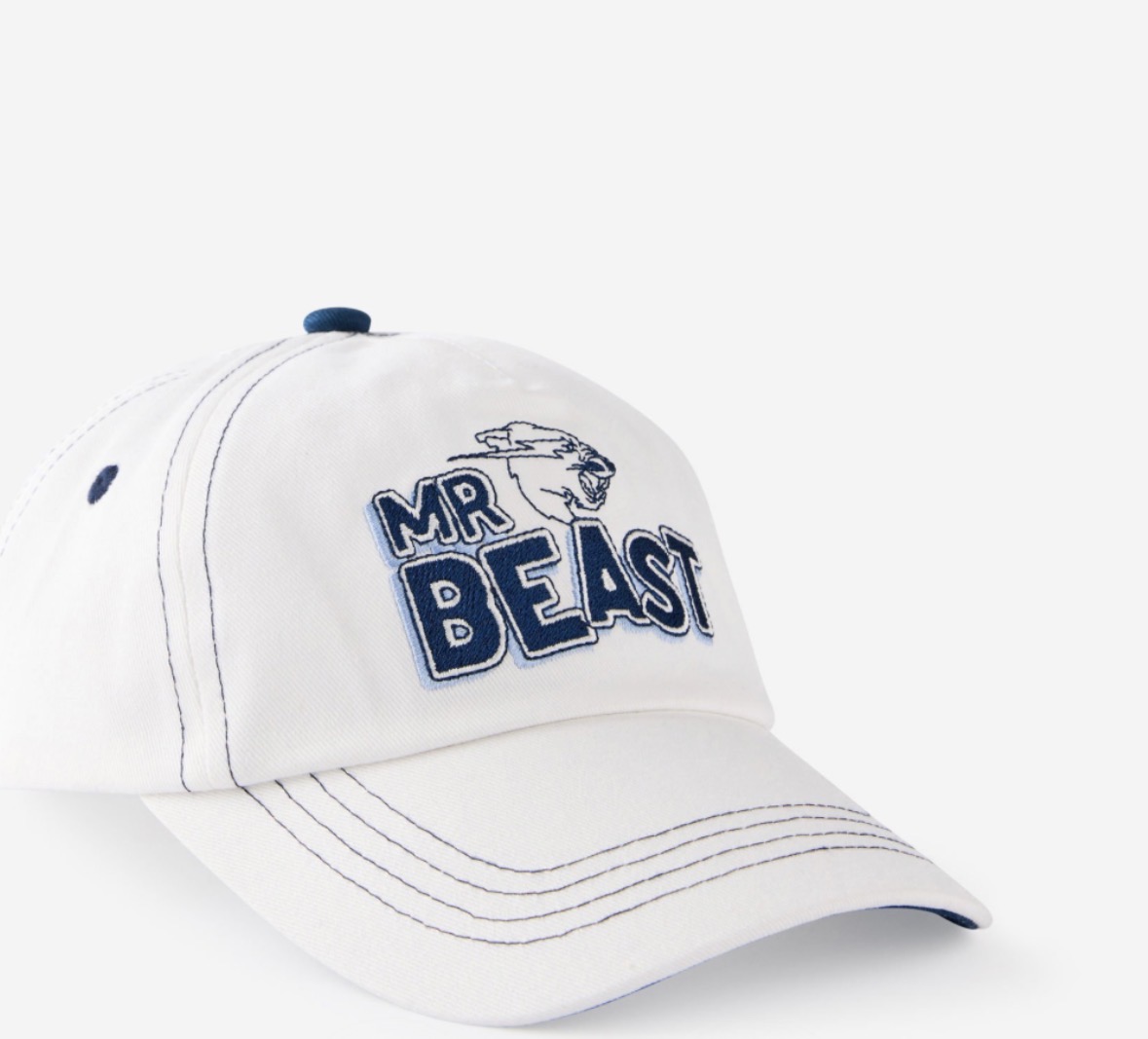 White MrBeast dad cap with navy chenille Beast lettering and contrast stitching
