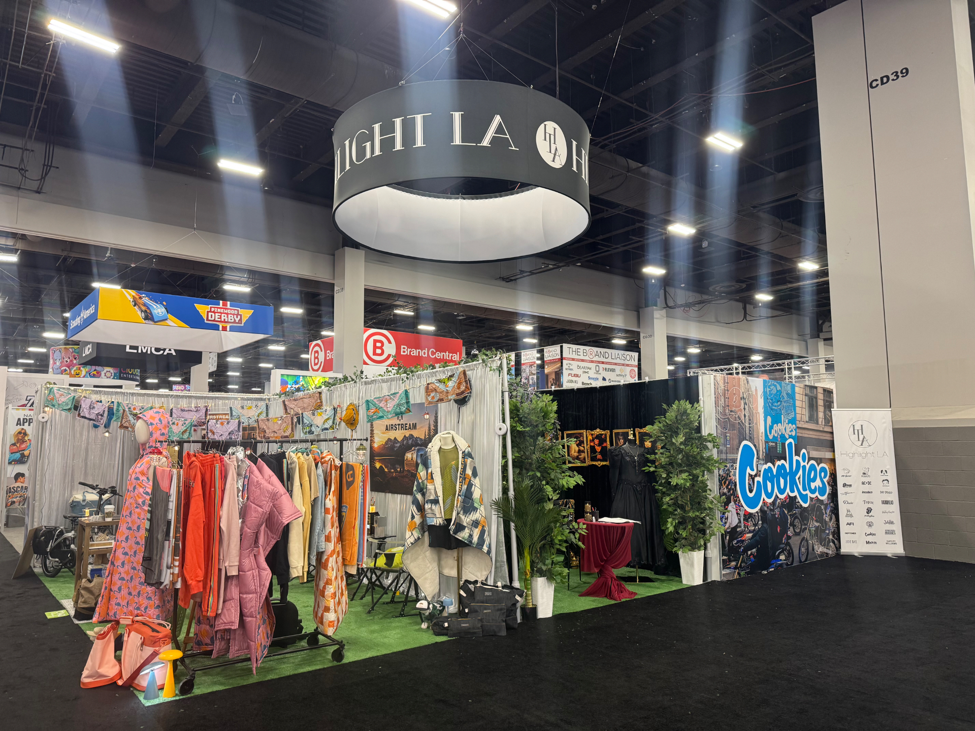 Highlight LA flagship booth at Licensing Expo featuring Airstream apparel racks and the Cookies brand wall