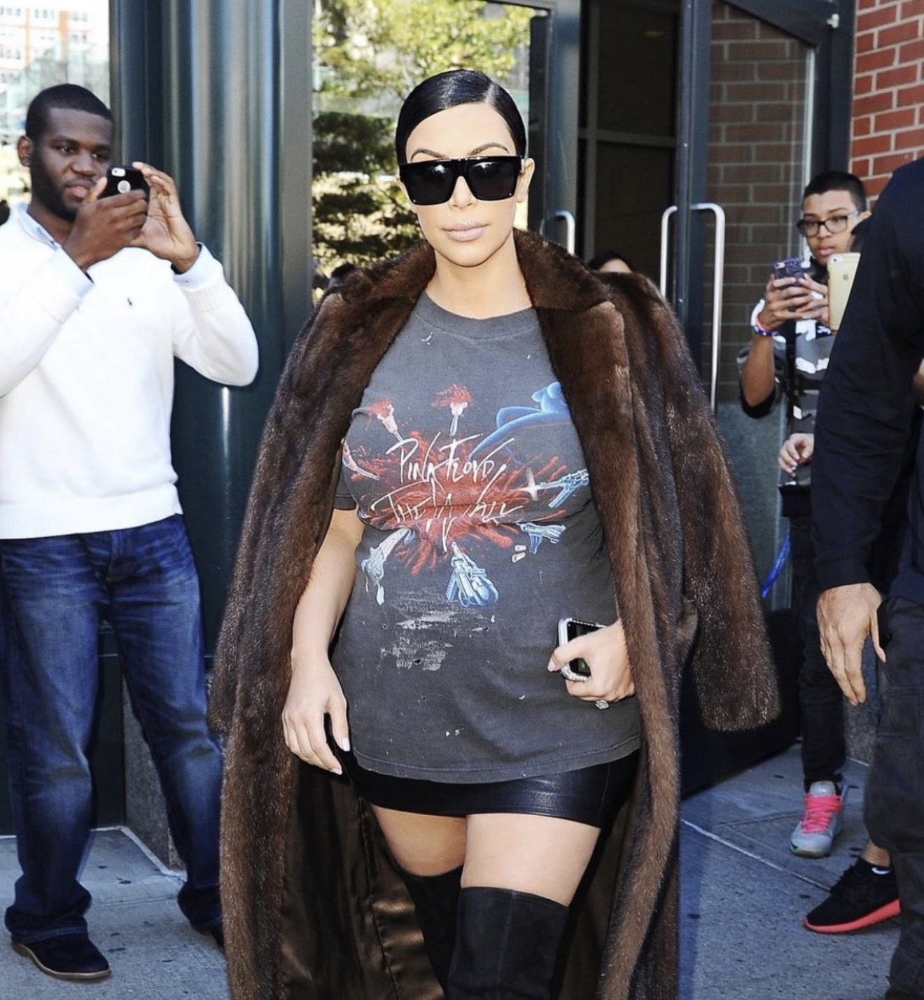 Kim Kardashian wearing a vintage Pink Floyd The Wall graphic tee with a fur coat while pregnant